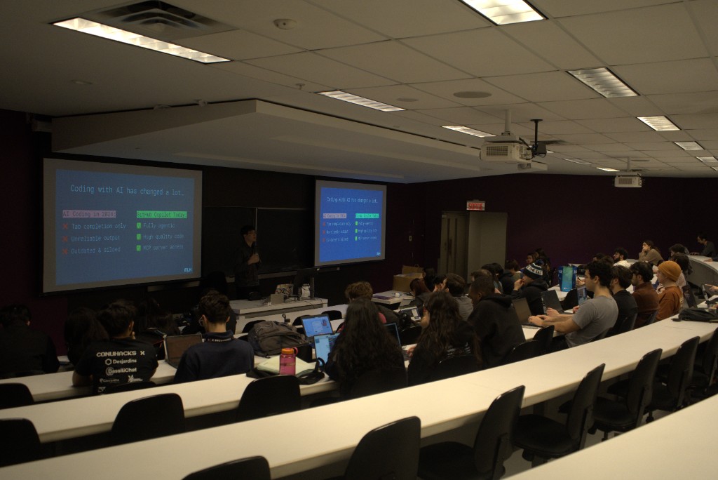 Picture of many students, including Daniel Ganchev and Sufiyan Naseem during a workshop on Coding with AI and Github.