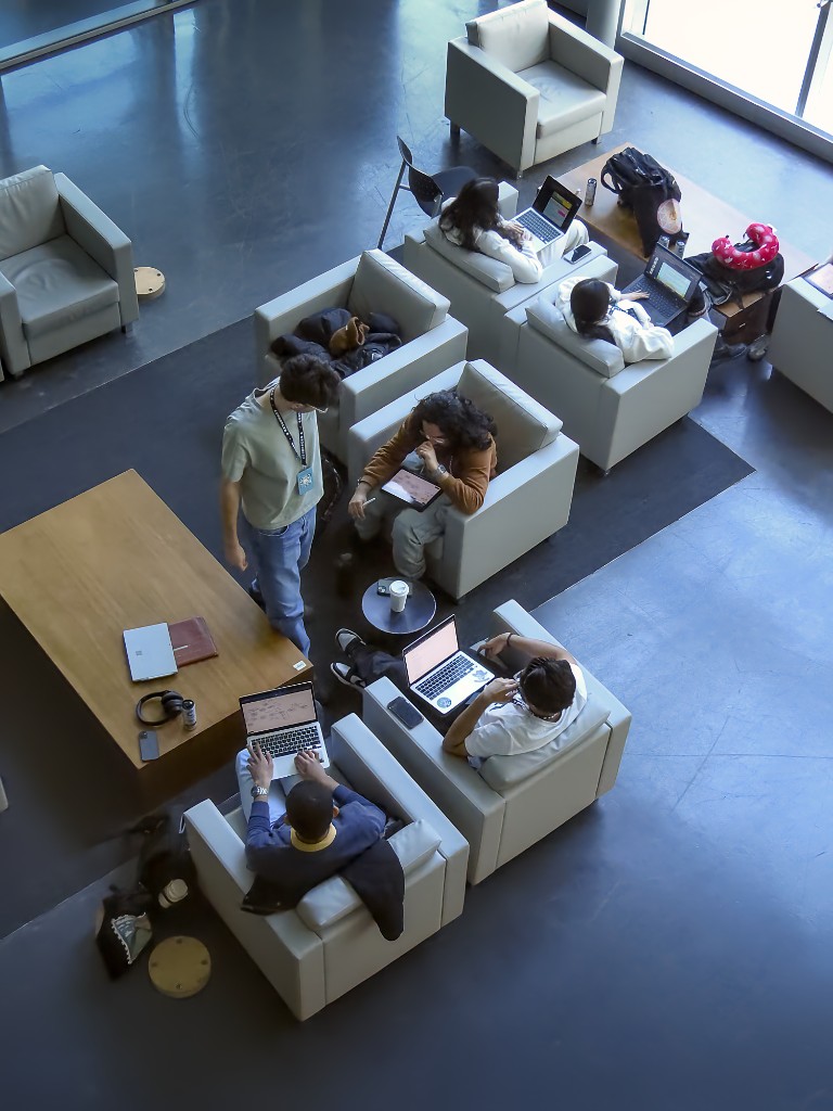 Picture of Sufiyan and his teammates Abdulrahman Kikia, Dawoud Naseem and Daniel Ganchev, working on their project for ConUHacks 2026.